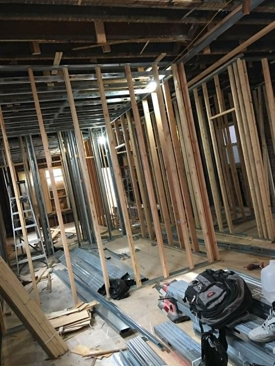 Interior gut renovation with exposed wood framing during a complete remodel