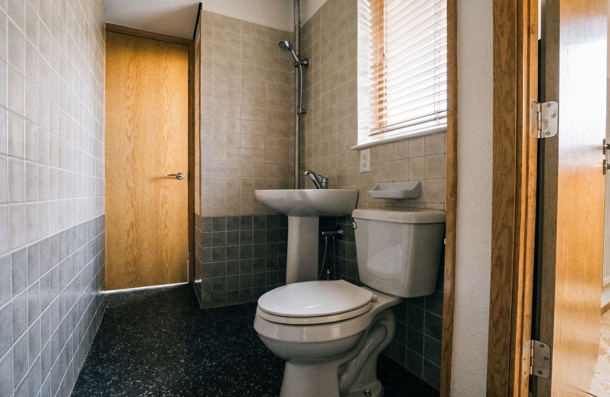 Illustrative renovated compact multifamily bathroom