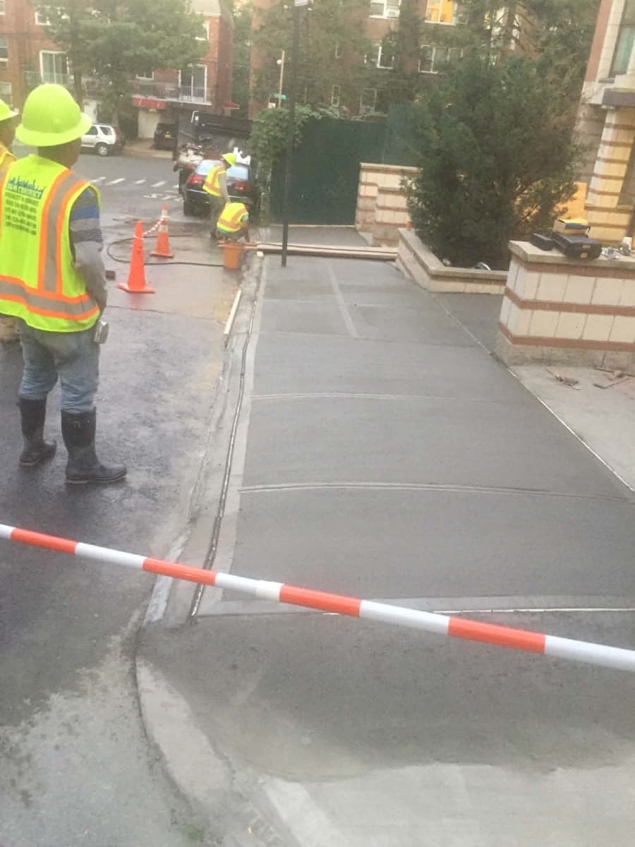 New concrete walkway divided into finished rectangular sections