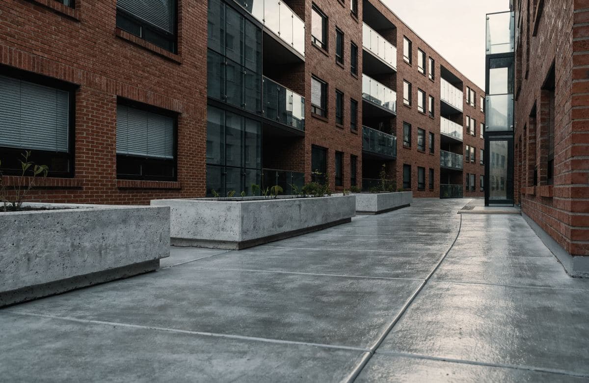 Illustrative condominium walkway with a smooth new concrete surface