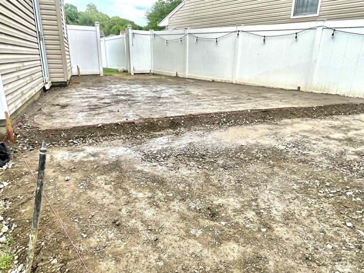 Unused dirt yard area before a concrete surface is installed
