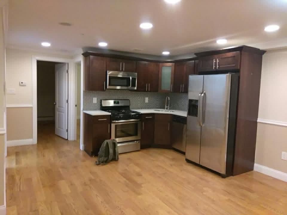 Completed kitchen remodel with finished cabinetry and countertops