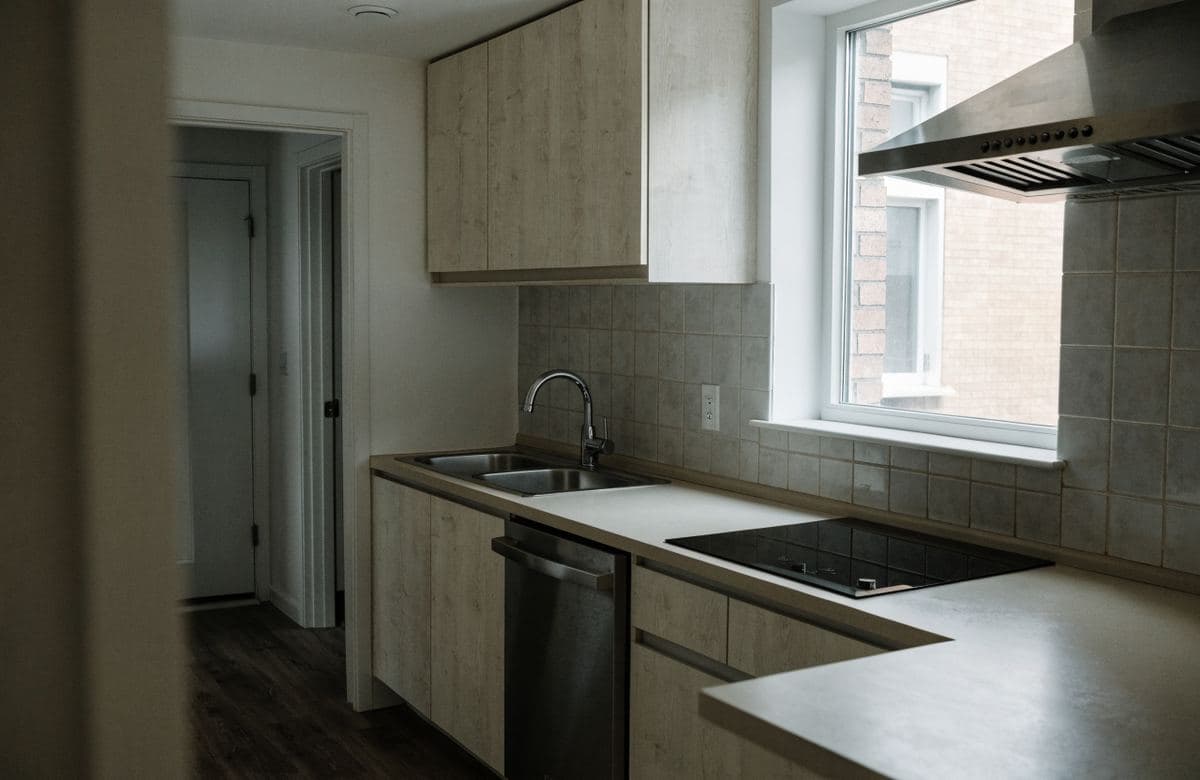 Illustrative renovated compact multifamily kitchen