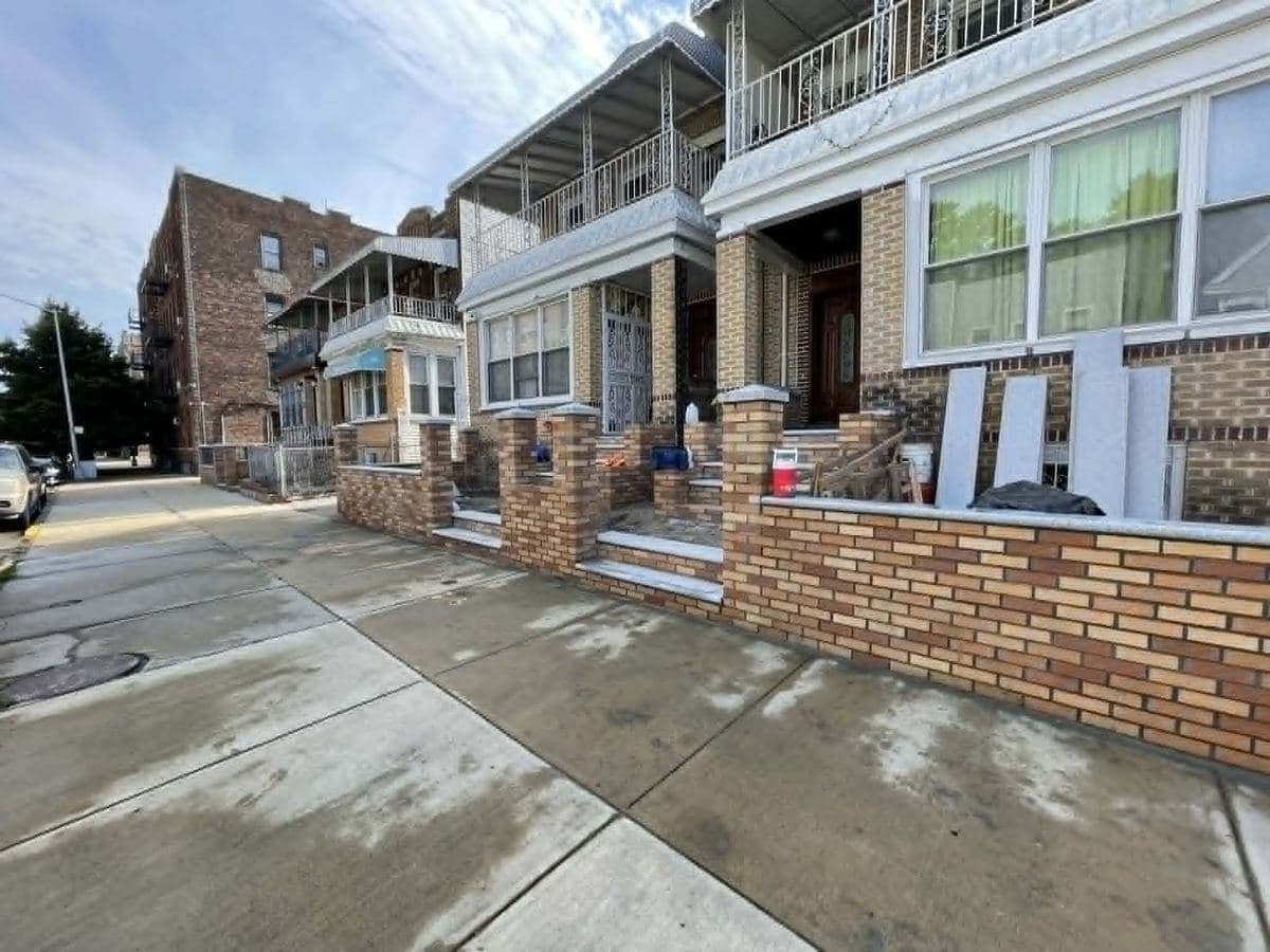 Brick homes with finished masonry columns, steps and frontage work