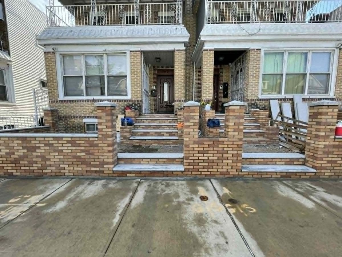 Brick home frontages with masonry columns and steps