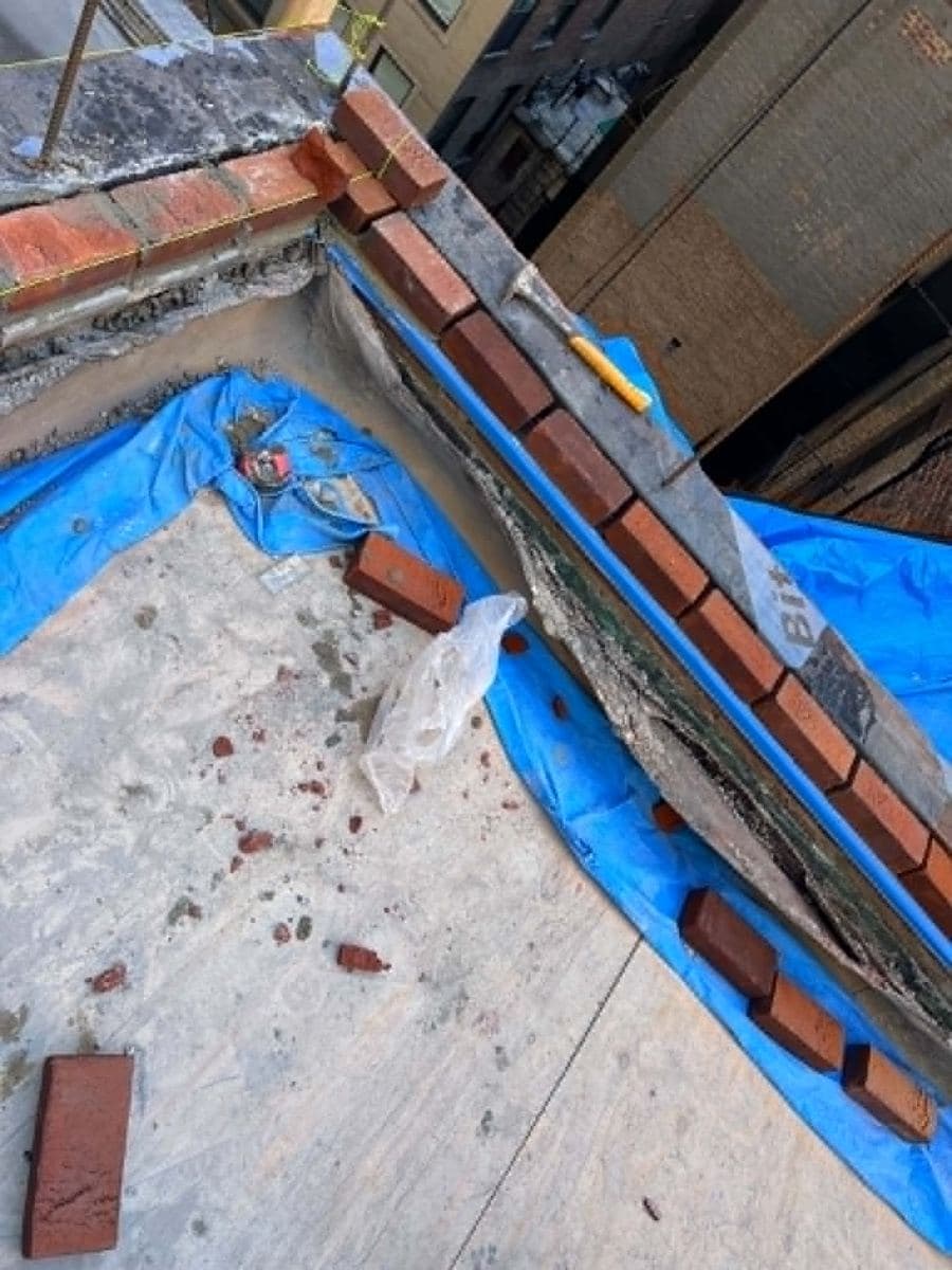 Rooftop masonry area being prepared for repair