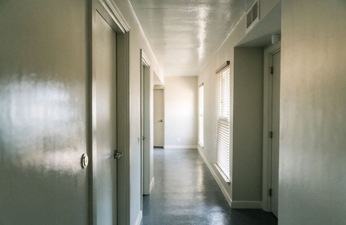 Illustrative freshly painted multifamily building hallway