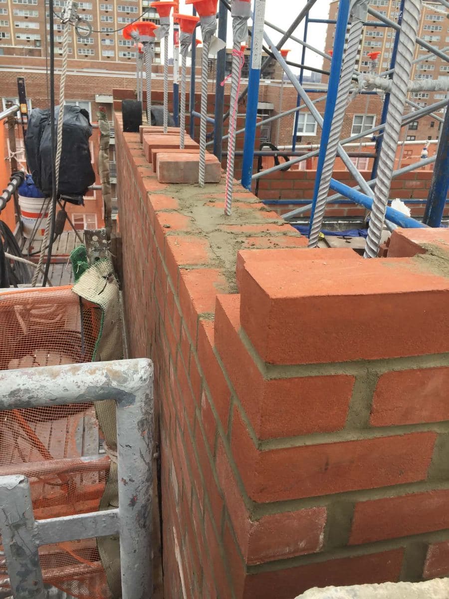 New parapet brickwork with clean, consistent joint lines
