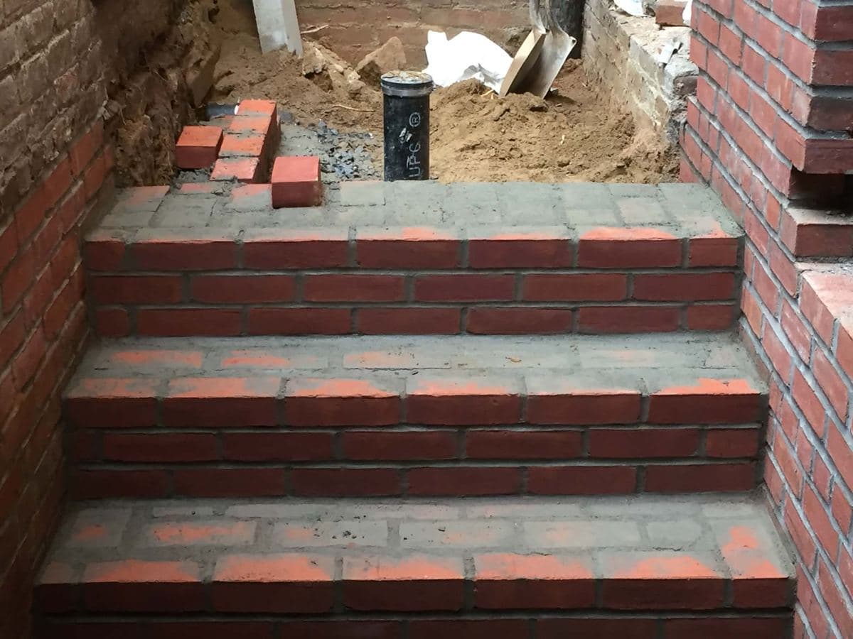 Rebuilt brick steps with freshly finished mortar joints
