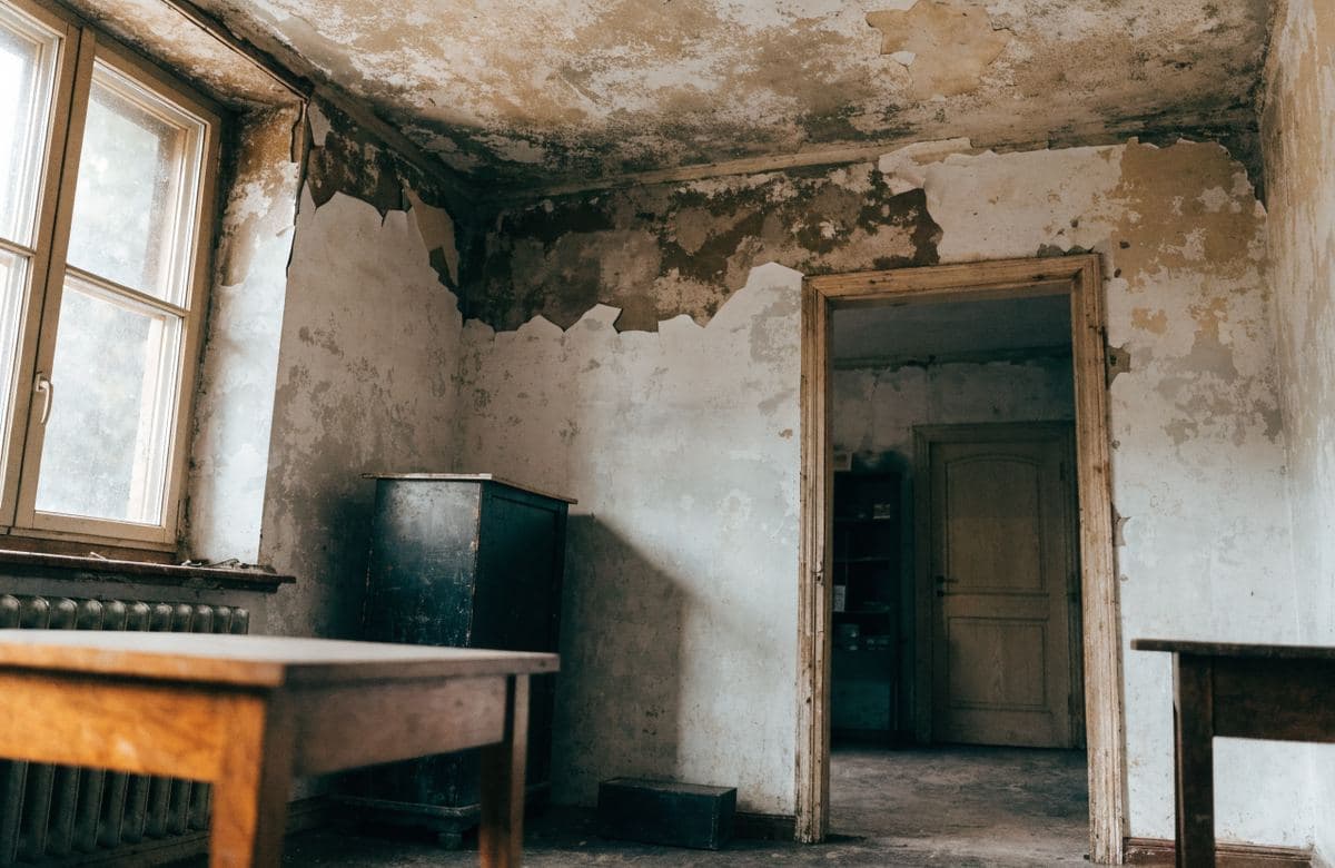 Illustrative interior room with a water-stained ceiling from roof problems
